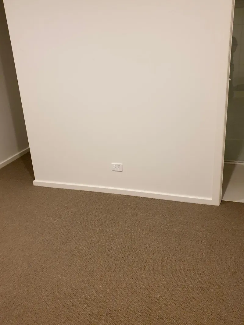 Double power point low on a freshly painted bedroom wall