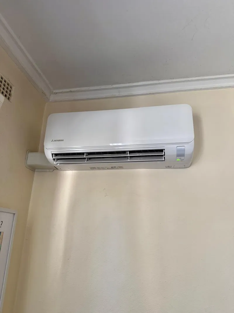 Mitsubishi Heavy Industries split system indoor unit high on a room wall