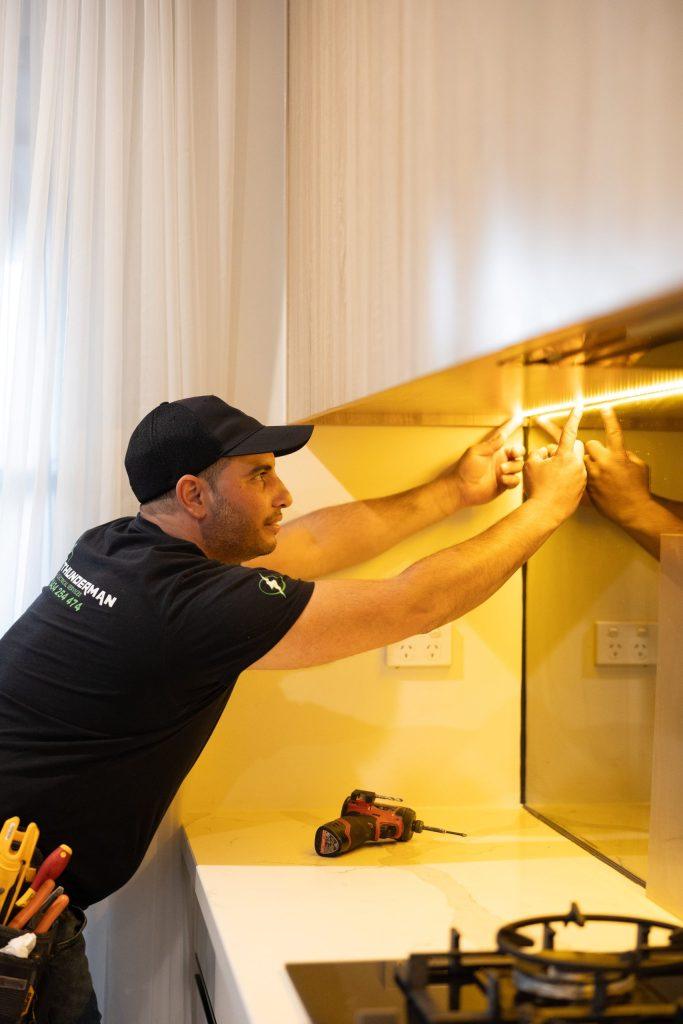 Thunderman electrician installing LED lighting in a kitchen in Melbourne