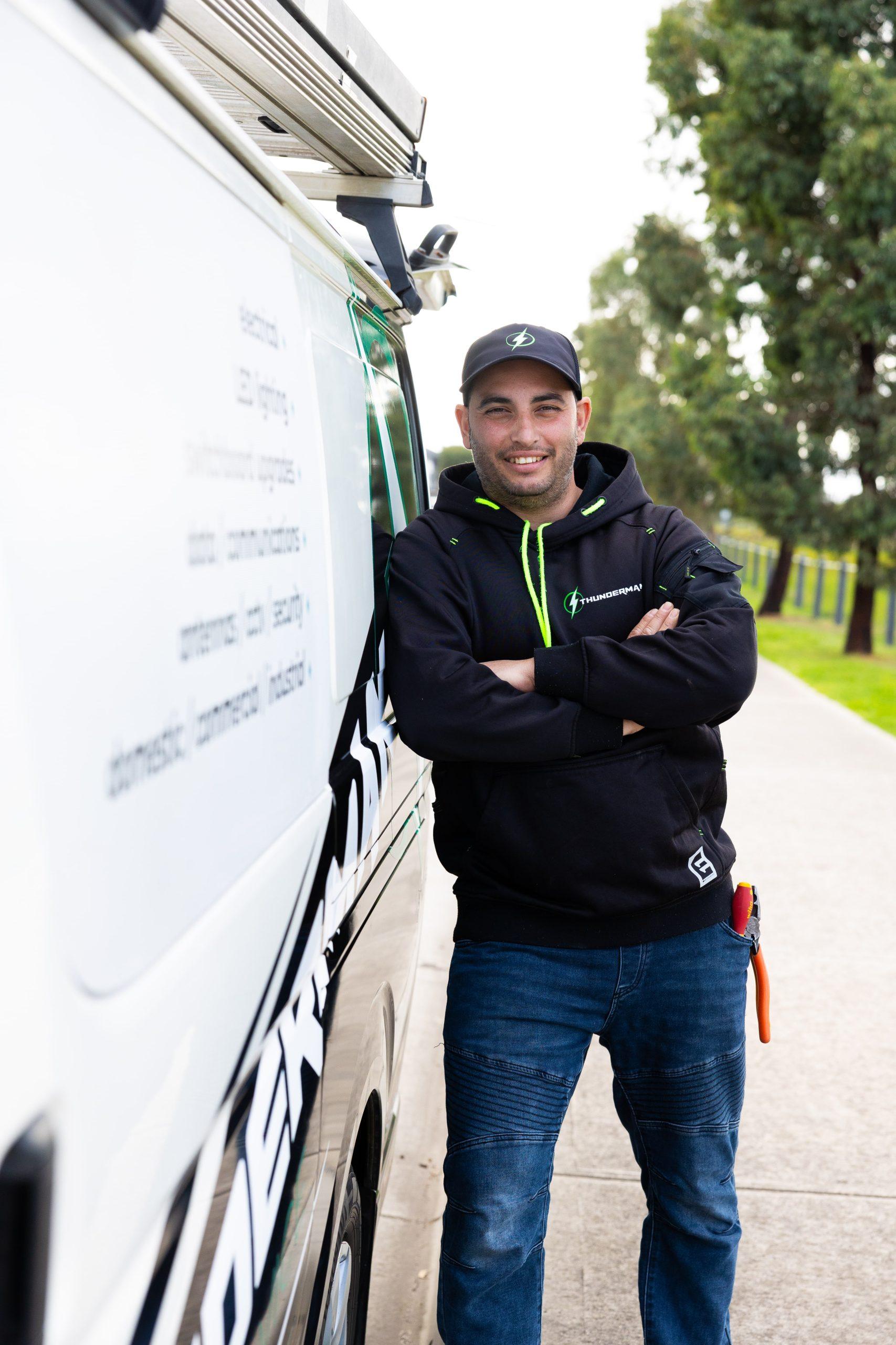 Electrician from Thunderman Electrical Services standing next to a van in Melbourne